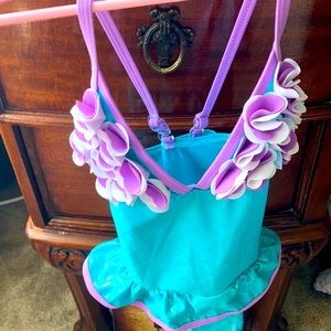 Blue swimsuit with lilac trim